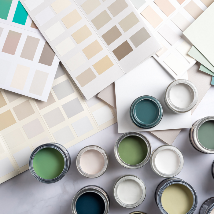 Guide showing various paint color swatches on a palette, illustrating the process of choosing the ideal paint color for kitchen cabinets, with a focus on color harmony and kitchen style